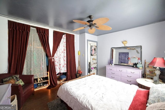 bedroom with wood-type flooring and ceiling fan