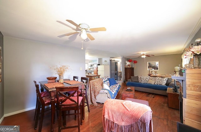 dining area with dark hardwood / wood-style floors and ceiling fan