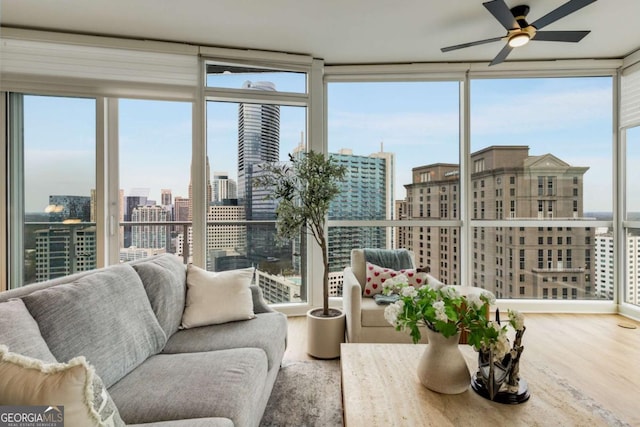 sunroom / solarium featuring a city view