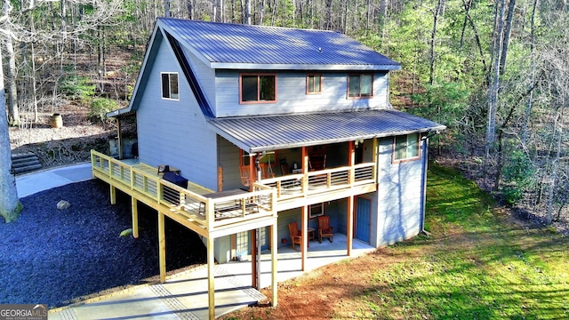 exterior space with a patio and a deck