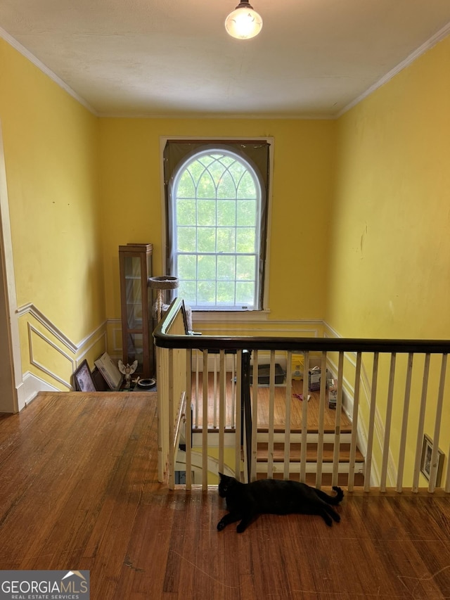 staircase featuring ornamental molding