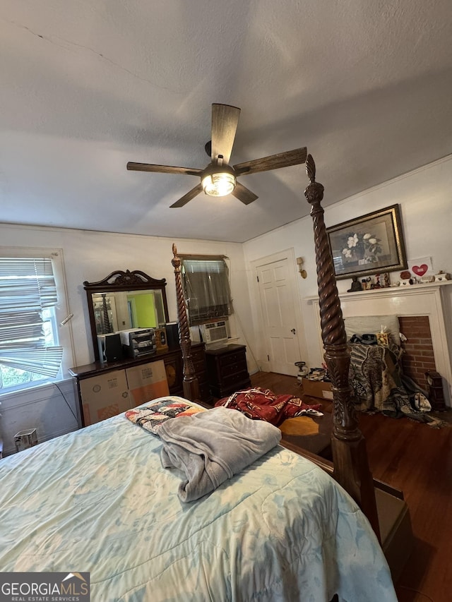 bedroom with ceiling fan and wood finished floors