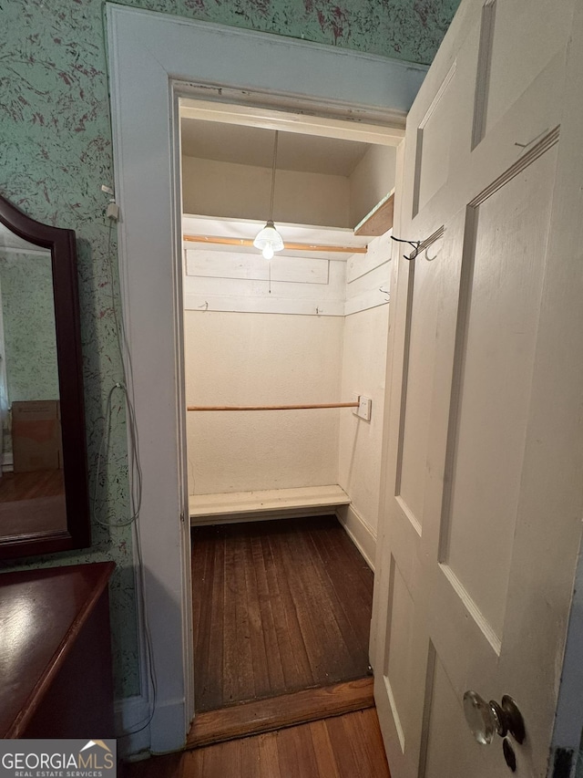 spacious closet featuring hardwood / wood-style floors