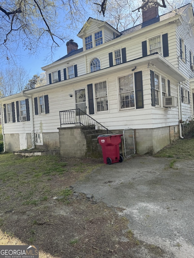 view of front of property featuring a chimney