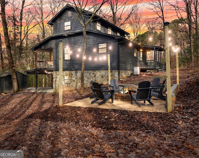 136 Fox Run Dr, Blue Ridge, GA 30513 - exterior space with an outdoor fire pit and a patio