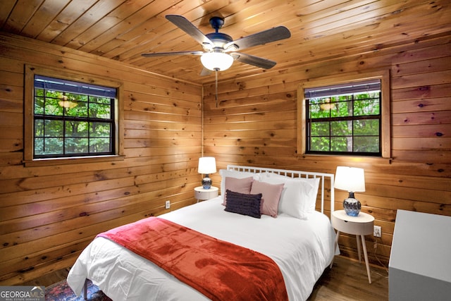 bedroom with hardwood / wood-style flooring, wooden ceiling, and wood walls