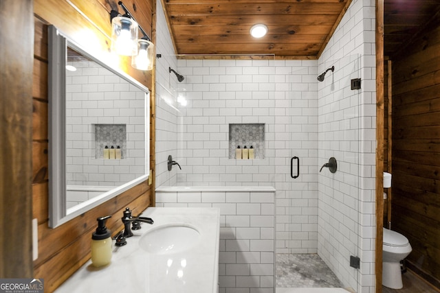 bathroom with toilet, an enclosed shower, tile walls, wooden ceiling, and vanity