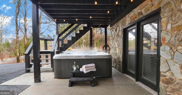 view of patio featuring a hot tub