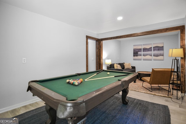 recreation room with hardwood / wood-style flooring and pool table