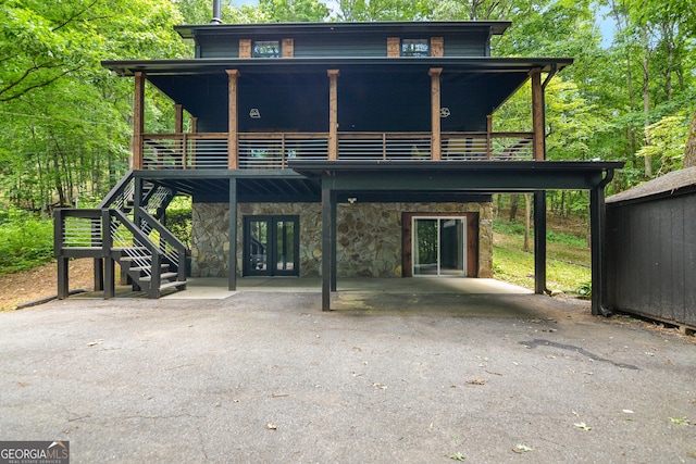 back of property featuring a deck