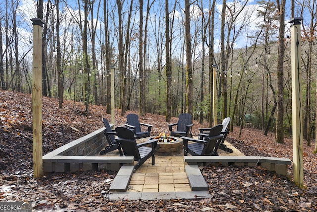 view of patio featuring an outdoor fire pit