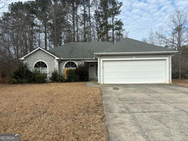 single story home featuring a garage