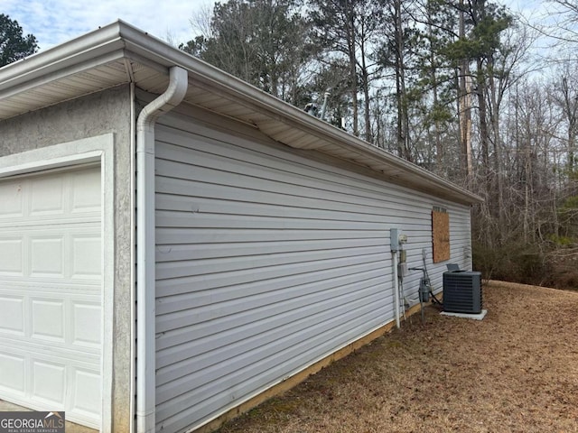 40 Brandon Dr, Covington, GA 30016 - view of side of home featuring a garage and central air condition unit