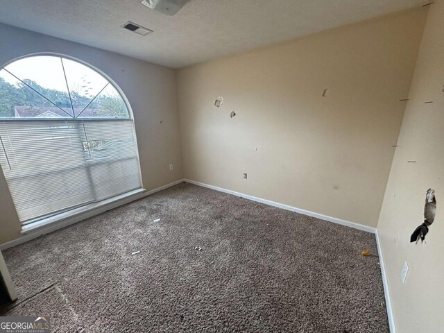 40 Brandon Dr, Covington, GA 30016 - unfurnished room featuring carpet floors and a textured ceiling