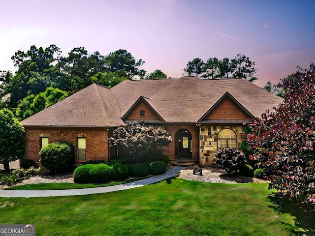 tudor-style house with a lawn