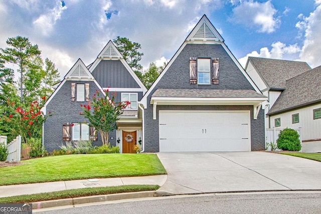 view of front of property with a garage and a front yard