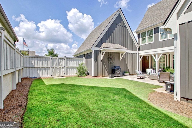 view of yard with outdoor lounge area and a patio area