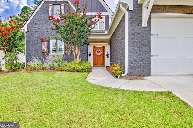 view of front of home with a garage and a front yard