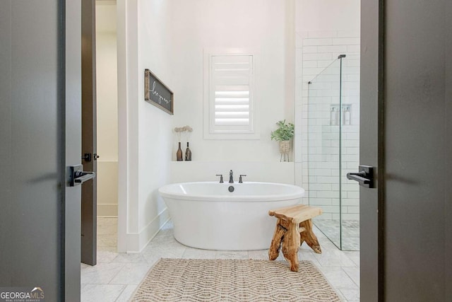 bathroom featuring tile patterned floors and shower with separate bathtub