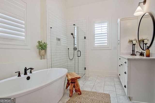 bathroom with vanity and independent shower and bath