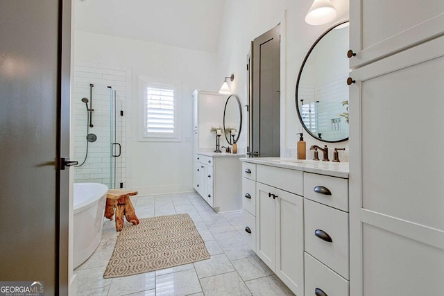 bathroom featuring vanity and shower with separate bathtub