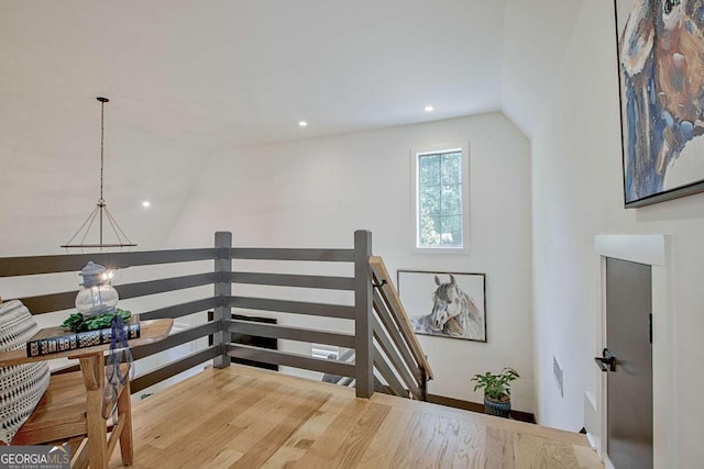 stairway featuring vaulted ceiling