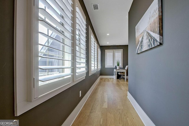 hallway featuring light hardwood / wood-style flooring