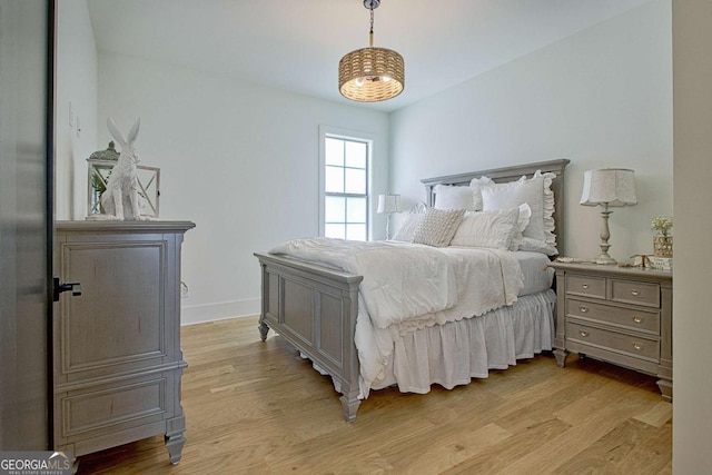 bedroom with light hardwood / wood-style flooring