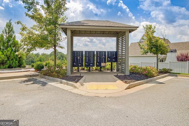 surrounding community with a gazebo and a mail area