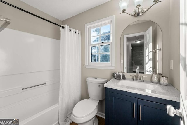 full bathroom featuring vanity, shower / bath combination with curtain, and toilet