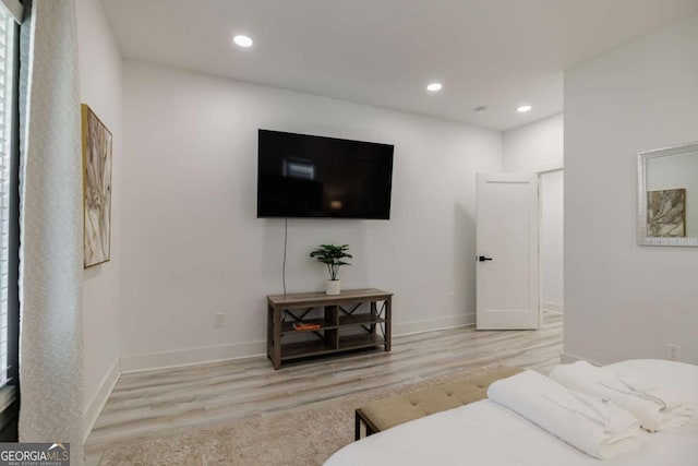 bedroom with light wood-type flooring