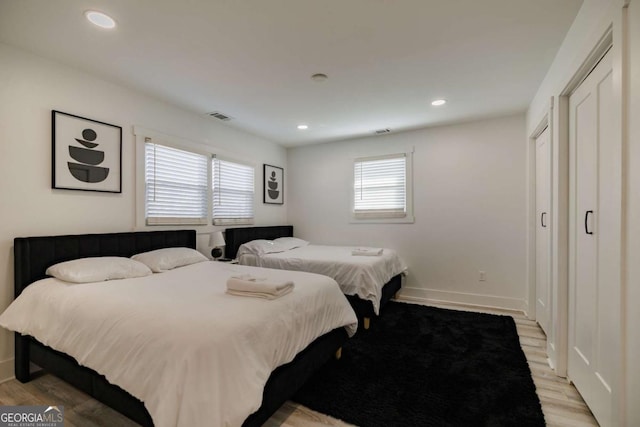 bedroom with light hardwood / wood-style flooring