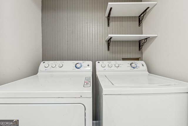 bathroom featuring enclosed tub / shower combo and toilet