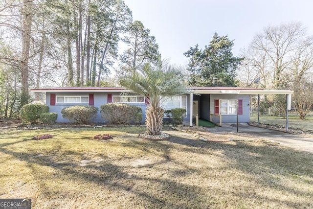 ranch-style house with a carport and a front yard