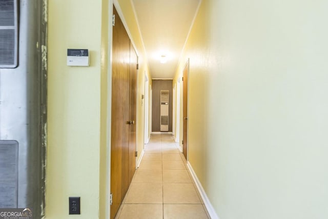 corridor with light tile patterned floors