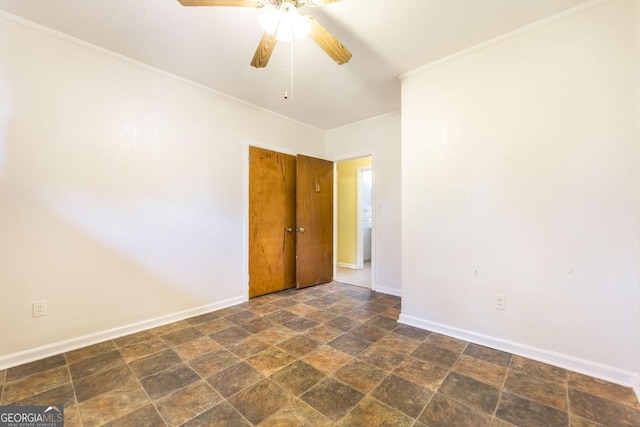 spare room with ornamental molding and ceiling fan