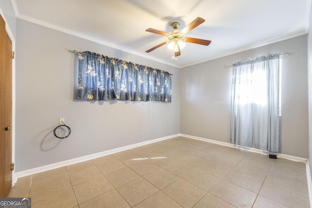 tiled empty room featuring ceiling fan and ornamental molding