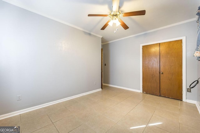 unfurnished bedroom featuring ornamental molding, light tile patterned flooring, and ceiling fan