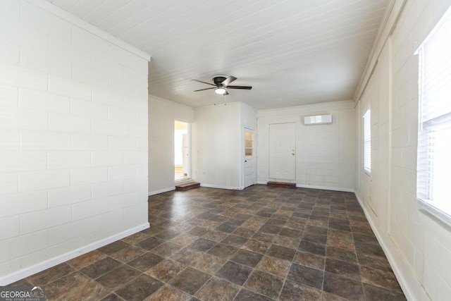 unfurnished room with an AC wall unit and ceiling fan