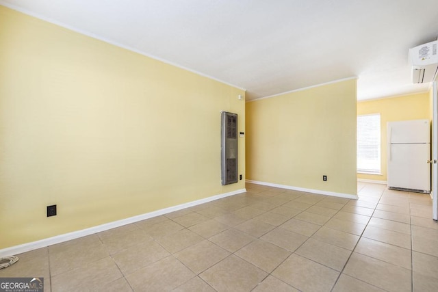 tiled empty room with a wall mounted AC