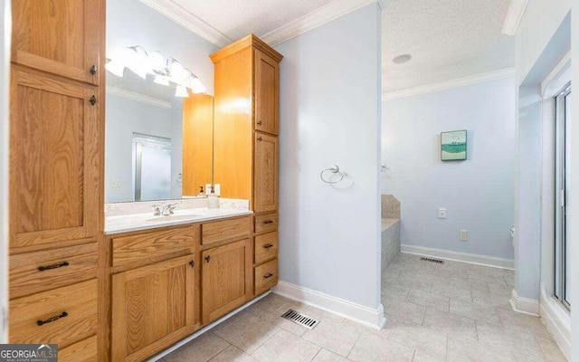 bathroom with ornamental molding and vanity