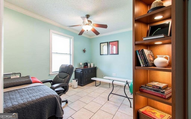 office area featuring ceiling fan, ornamental molding, a textured ceiling, and light tile patterned floors