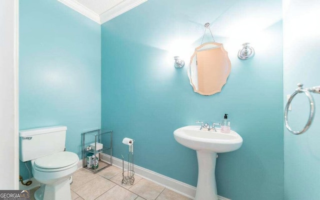 bathroom with ornamental molding, tile patterned floors, and toilet