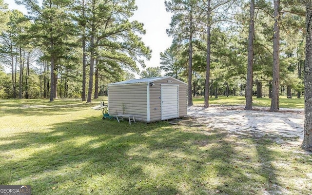 view of outdoor structure featuring a yard