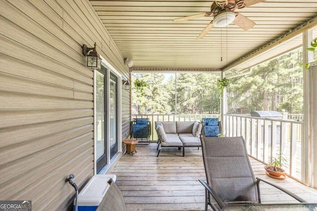 wooden deck with ceiling fan