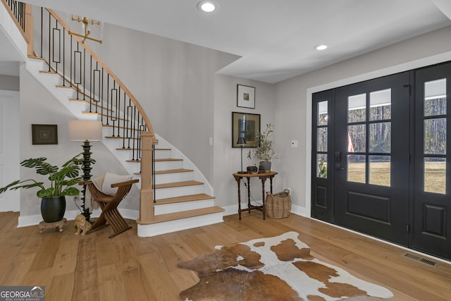 foyer entrance featuring hardwood / wood-style flooring