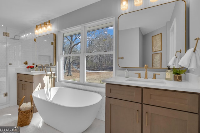 bathroom featuring plenty of natural light, separate shower and tub, and vanity