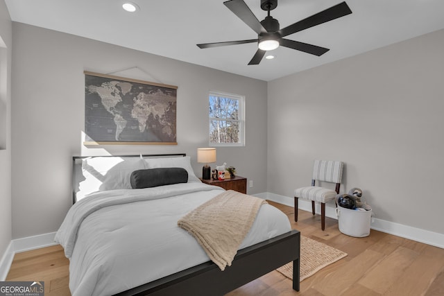 bedroom featuring hardwood / wood-style floors and ceiling fan