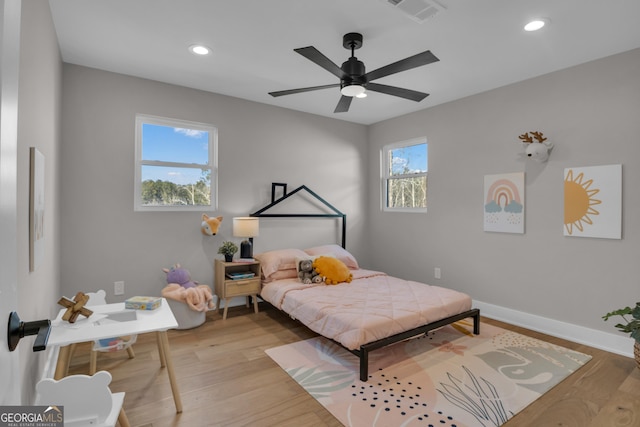 bedroom featuring ceiling fan and light wood-type flooring