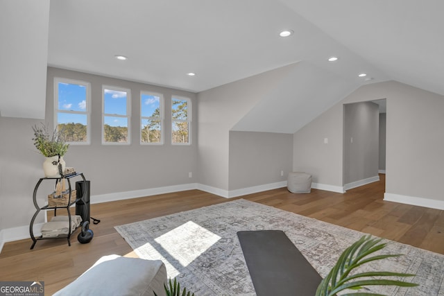 bonus room featuring lofted ceiling and light hardwood / wood-style floors